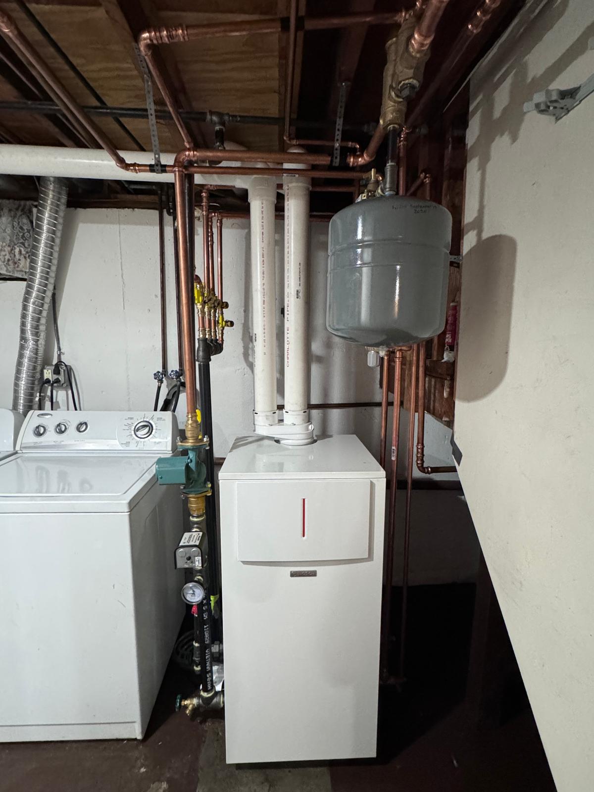 Residential boiler and copper piping in a utility room